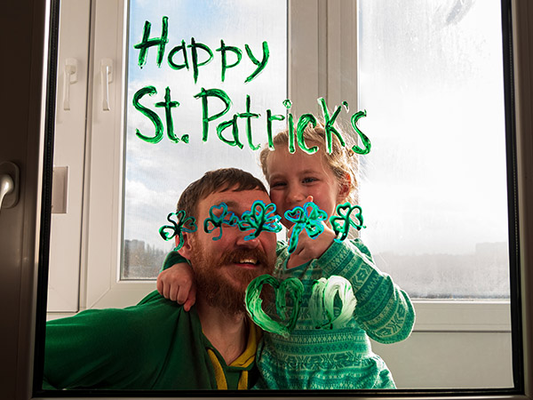 Dad and daughter with St. Patrick's Day window art